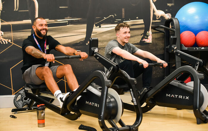Trevor works in a gym mentoring a young person